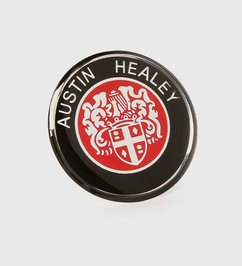 Self adhesive badges with motives